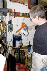 Mechanic making biodiesel in workshop England