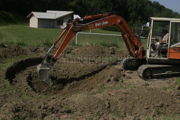 Digging of the pond of Saint-Laurent-in-Beaumont Isere