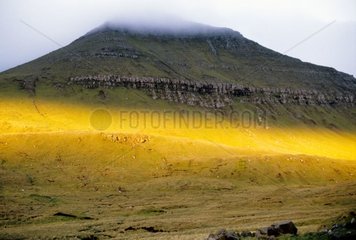 Stripe light on a hill of the Faroe islands