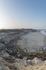 Dune retreat and dumping of plastic waste by the sea  following the storm Eleanor on the Côte d'Opale in winter  Wissant  France