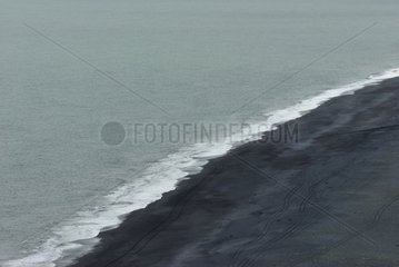 Sandy beach of black basalt in Iceland