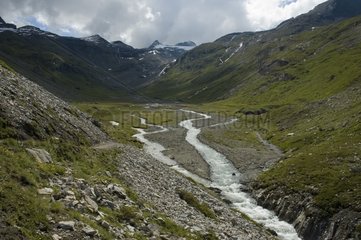 Torrent resulting from melt of a glacier in an alpin valley