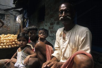 Old man and his grand-children in a Calcutta lane India