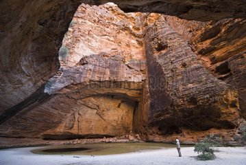 Lonely woman in the Cathedral Gorge in Purnululu Australia