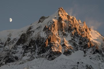 Gibbous moon and Aiguille du Midi at sunset - Alps France