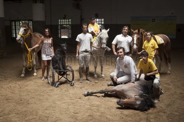 Therapists and patients in a horse therapy center