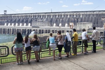 Tourists and Itaipu Dam between Brazil and Paraguay