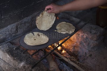 Child preparing tacos with his mother - Guanajuato Mexico