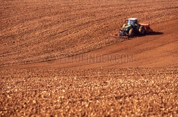 Tractor and seed drill please a field