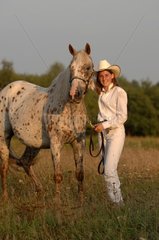 Western riding woman and Horse Appaloosa - France