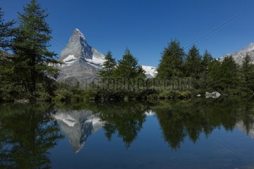 Reflection of the Matterhorn on a mountain lake - Swiss Alps