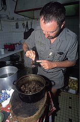 ONCFS nature guard inspecting a bushmeat kitchen