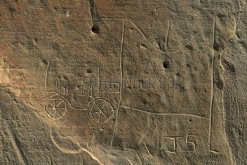 Petroglyphs Indians representing a carriage of colonists