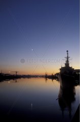 Nantes harbour with boats and the 5 days old Moon