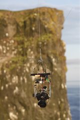 Device for photographing birds in the cliffs Iceland