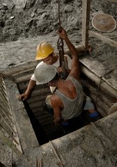 Minors going down in an emerald mine Brazil
