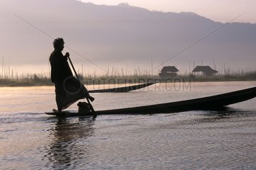 Silhouette of a man on his boat Burma