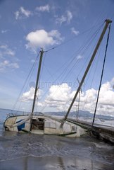 Sailboat aground on a beach in Martinique Island