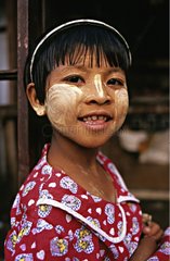 Portrait of a girl with thanakha on face Myanmar