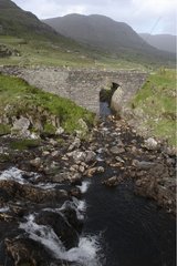 Gap of Dunloe stone bridge in a glacial valley Ireland