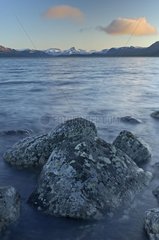 Rocks in a lake and Mountains Finland