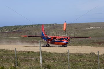 Plane landing on Sea Lion Island Falkland Islands
