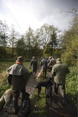 Group of hunters with their labradors during hunt time