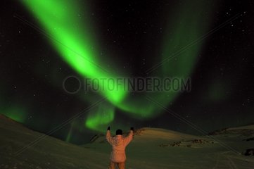 Man and Northern Lights East coast Greenland