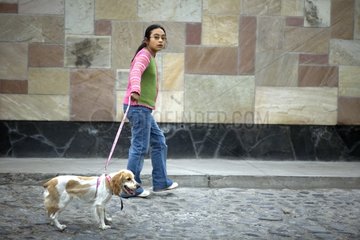 Girl walking her Dog Arequipa city Peru