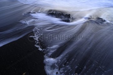 Wave on black sand Iceland