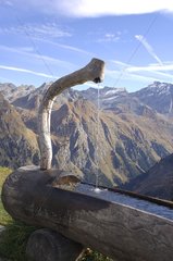 Fontaine in a watering Alpine mountain Switzerland