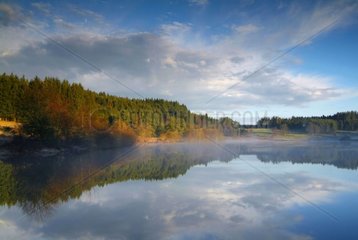 Reflections in the Malaguet Lake at morning Auvergne France