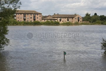 Footpath sign submerged in flood plain UK