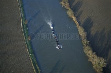 Air photograph of a barge sailing on the Oise river