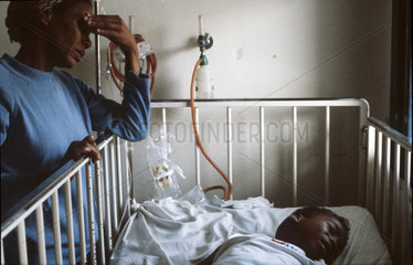 Rio de Janeiro  Brazil. Black woman takes care of her son in a public hospital. Meningitis epidemy.