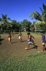 Children playing soccer in Heapiti in Tahiti in French Polynesia