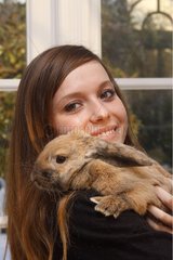 Aries domestic rabbit and his mistress souriante