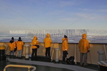 Tourists on a boat watching the sea ice Antarctica