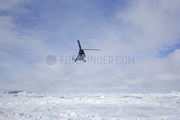 Helicopters flying over the sea ice Antarctica