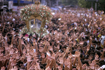Cirio de Nazare religious festival. City: Belem  State: Para; Brazil. Religion  faith  religious fervour  hands up.