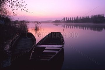 Boats in the marsh of Goulaine at sunrise France