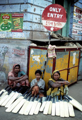 INDIA : Gujarat. Bhuj. Street vendor selling cricket bats. Cricket is the most popular sport in India.
