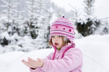 Little girl and snow flakes