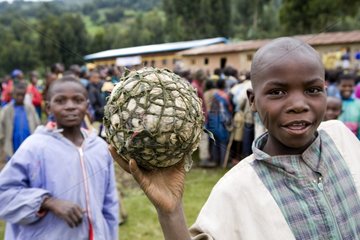 Portrait of a child showing a balloon of foot Rwanda