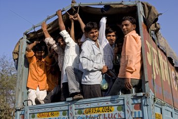 Passengers in the back of a truck Uttar Pradesh India