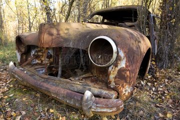 Carcass of car given up in a wood France