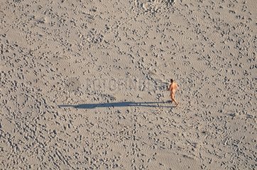 Man walking naked on the beach Bay Audierne France