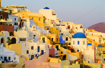 Santorini Greece and the beautiful white buildings on the mountain cliffs of the small isolated roamntic city of Oia