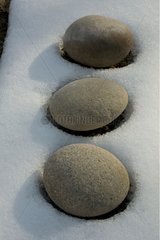 Stones laid on the snow in Provence