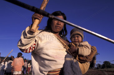 Brazil. Guarani-Kaiowas indigenous people. War demonstration. Participation of women and children. Recovery of traditional territory. The indians face the armed authority of the farmers and long judicial battles for the demarcation and permanence in their
